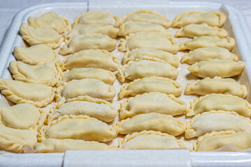 Vareniki. Homemade dumplings. Handmade dough food. Russian kitchen.