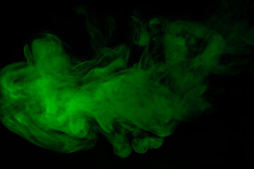 Fototapeta premium Green steam on a black background.