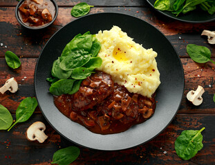Salisbury Steak with mushroom gravy, mashed potatoes and spinach