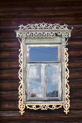 windows with carved frames and shutters in village houses