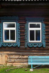 windows with carved frames and shutters in village houses