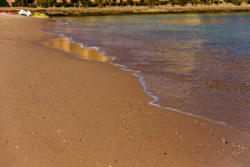 Closeup of the sand on beach and Red sea water