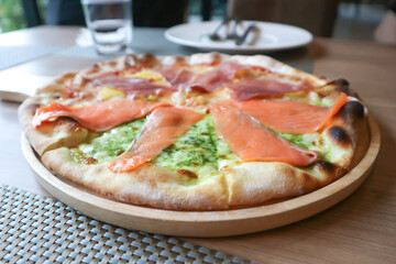 salmon pizza , salami pizza or mixed pizza