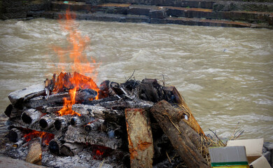 funeral pyre in Nepal Burning Hindu funeral pyre,Hindu funeral rights of burning the body on a tall...