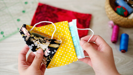 Face mask made out of cotton fabric place on wood texture table