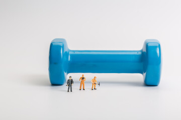 A pair of blue dumbbells on white background