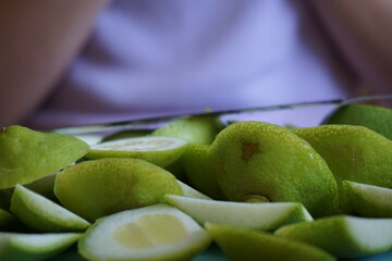 Slicing limes for lemonade and jam