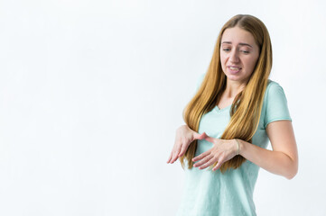 frightened girl looking down with her eyes on a white background