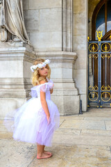 Girl ballerina Paris stay on old stone background. Old stone background. Beautiful model. Happy dancing people. Love fashion. © Elena