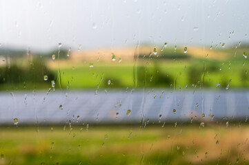 Beautiful sceenery of a little solar park in Bavaria, sourrounded by beautiful landscape in a little valley. Photograph was taken meanwhile sunset