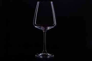 empty glass for wine on a black background. Red Wine Glass silhouette on Black Background