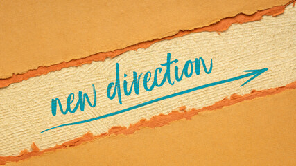 new direction, leadership, business or personal development concept - handwriting and sketch on handmade paper, web banner