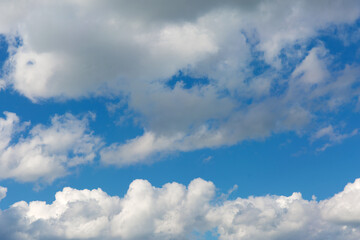 Naklejka na ściany i meble Gray clouds on blue sky background.