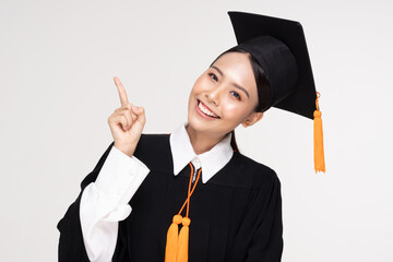 Beautiful Attractive Asian woman graduated in cap and gown smile