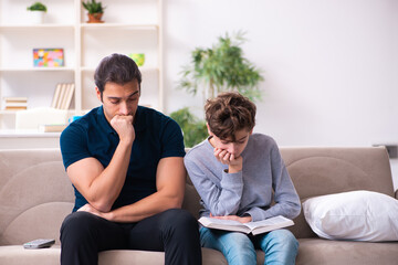 Father and son in exam preparation concept