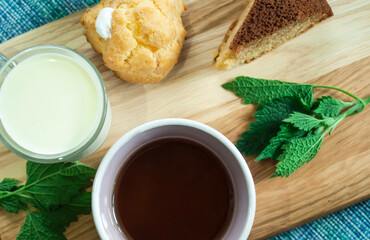cups with milk, compote, coffee, flat lay