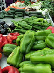 green and red sweet mix bell peppers close up bulgarian pepper fresh, assorted colorful capsicum paprika on a counter in the supermarket.