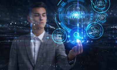 Business, Technology, Internet and network concept. Young businessman working on a virtual screen of the future and sees the inscription: Business network