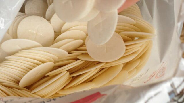 packaging, bag full of communion host communicants