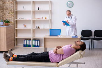 Young male patient visiting old male doctor