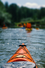Red kayak floats on the river