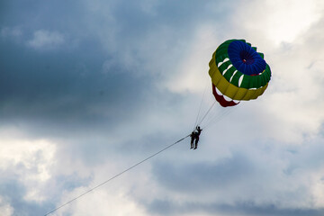 Parachute in the sunset sky.