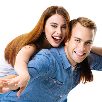 Portrait image of expressive amorous funny laughing couple. Standing piggy back ride models in love studio concept, isolated against white background. Man and woman posing together. Square composition