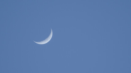 Fototapeta na wymiar The beautiful moon in the sky, blue background