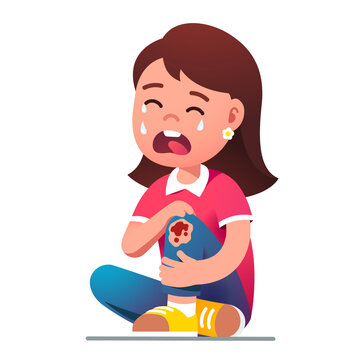 Kid girl sitting crying in pain over hurt knee