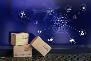 Cardboard boxes packaging the products on computer notebook background. concept about transportation or global shipping or international freight,overseas trade. online shopping concept. - obrazy, fototapety, plakaty