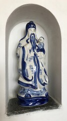 Buddhist Figurine in a Romanesque Niche