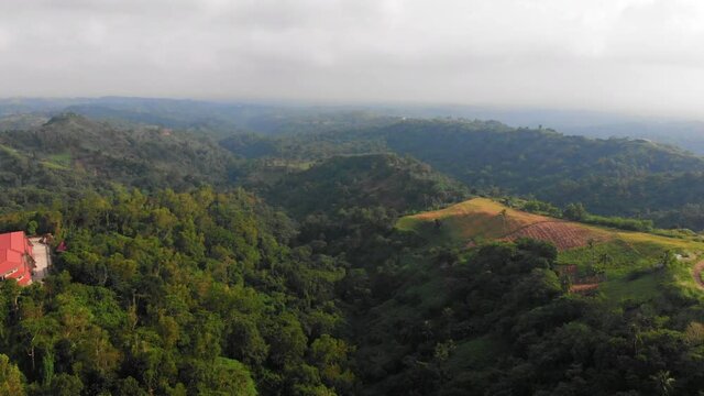Reverse aerial reveal of stunning mountainous scenery in Nasugbu, Batangas