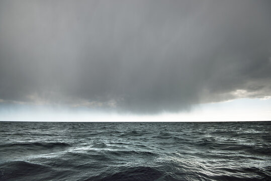 Glowing Clouds Above The Open Baltic Sea Before The Thunderstorm. Sweden Dramatic Sky, Epic Seascape. A View From The Yacht. Sailing In A Rough Weather