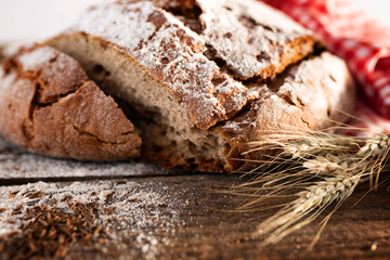 Fresh baked bread on rustic wood
Fresh crispy bread and flour on rustic wood. Background with short...