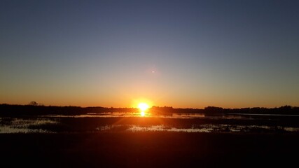 Obraz premium sunset over the river