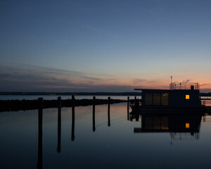 Fototapeta na wymiar Modern Houseboat at a Marina in Denmark