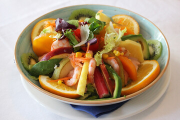Tropical salad with fruits, prawns and Cocktail sauce