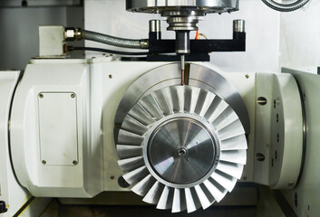 CNC milling machine work. Precision manufacturing of impeller in metalwork industry