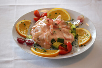 Prawn cocktail with fruits and cocktail sauce