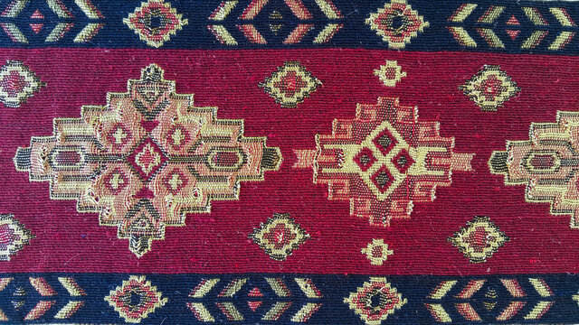 Fabric with Armenian pattern. Carpet detail with traditional ornaments and patterns. Embroidery is one of the oldest types of needlework. The old background.