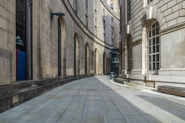 The curve of library walk in Manchester with the late evening sunlight casting into the shot. 