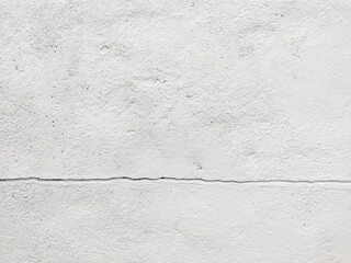 white painted wall with crack cracked