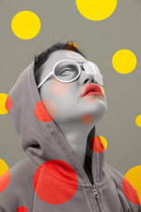 Art collage with alternative funky girl. Close up fashion portrait young beautiful woman in hoodie and white strange glasses with eye. Multi-colored circles. Unusual youth fashion concept.