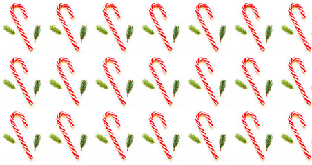 Christmas or New Year pattern of caramel cane and fir branches on white background. Design for wrapping paper