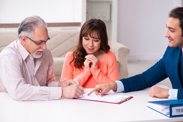 Young male lawyer, old man and his granddaughter in testament co