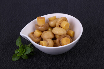 Pickled champignon heap in the bowl
