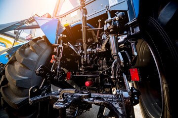 Rear view of modern agricultural tractor. Industrial details.