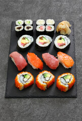 japanese sushi assorted : california rolls, maguro(tuna), salmon, futomaki(sushi burrito), negitoro(minced tuna roll), takuan(pickled daikon radish), kanpyo(dried gourd), kappa(cucumber), gari(pickled