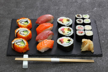 japanese sushi assorted : california rolls, maguro(tuna), salmon, futomaki(sushi burrito), negitoro(minced tuna roll), takuan(pickled daikon radish), kanpyo(dried gourd), kappa(cucumber), gari(pickled © uckyo