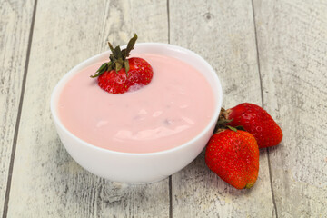 Yoghurt with strawberry in the bowl